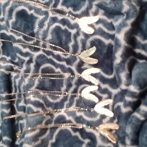 6 sliver tone feather necklaces never been worn brand new